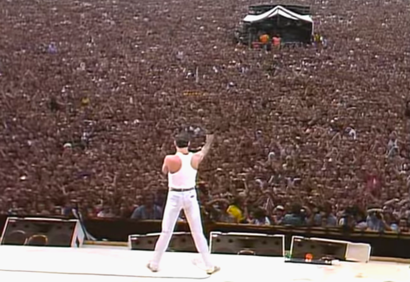 Image: Live Aid stage with Freddie Mercury in full rock-god pose at Wembley, 1985