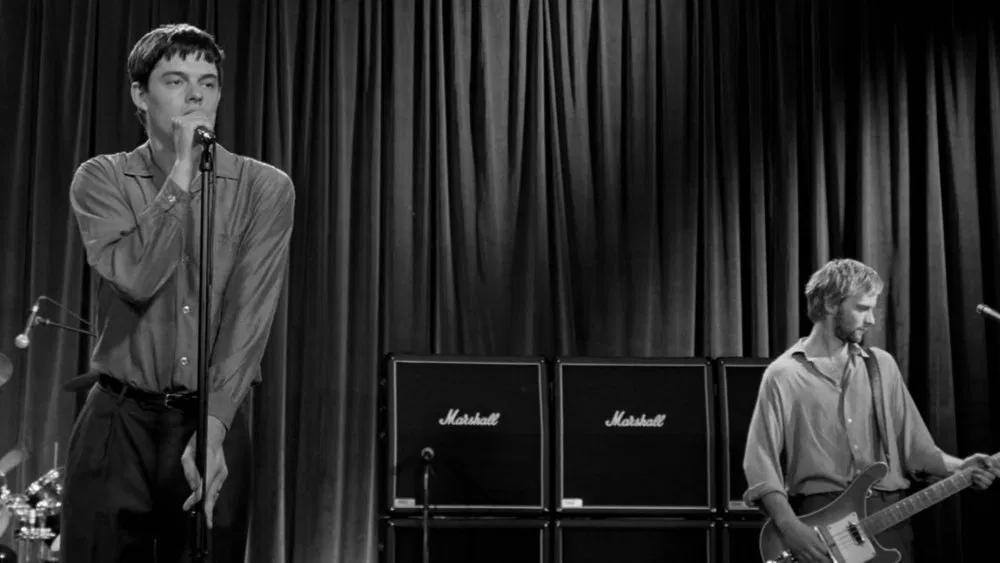 image of a joy division performance from the 2007 movie control