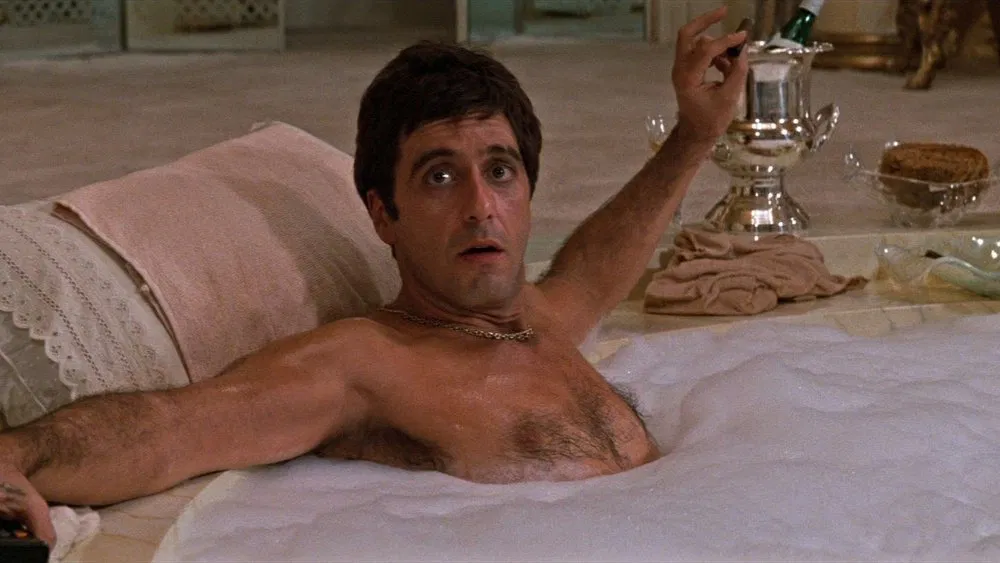 image of tony montana in the hot tub from the movie scarface 1983